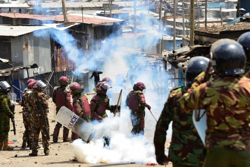File image of police officers dealing with anti-government protestors.